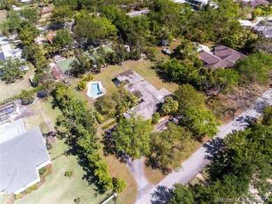 Aerial view of subject property and surrounding ho