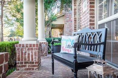 Enjoy a welcoming covered front porch with gorgeou