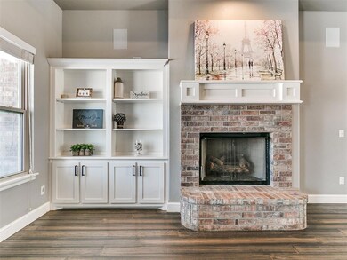 Living room featuring a fireplace, dark hardwood /