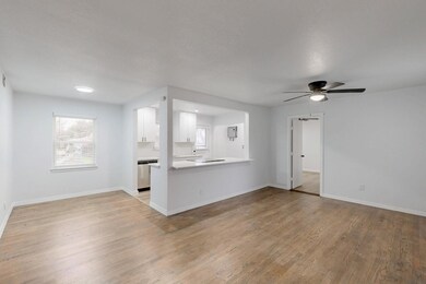 Unfurnished living room with ceiling fan, plenty o