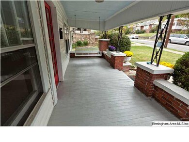 What a welcoming covered front porch. Swing all da