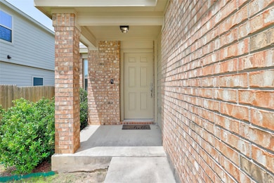 Entrance to property with brick siding