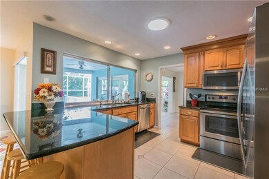 Open kitchen with Granite counters, breakfast bar,