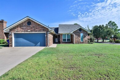 Ranch-style home with a garage and a front yard