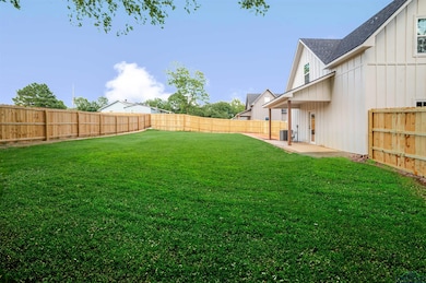 View of fenced backyard