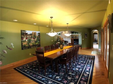 Large dining room with three doors leading straigh
