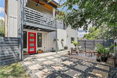 View of patio with a balcony, fence, and ceiling 