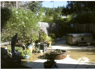 Yard with hot tub