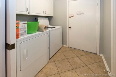 Separate laundry area off kitchen, door to garage.