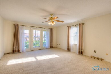 A spacious living room with a patio door leading t