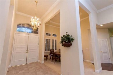 Elegant double door entry with tile flooring.