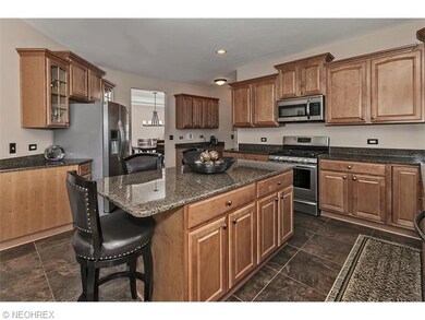 Center island breakfast bar is the focal point of 