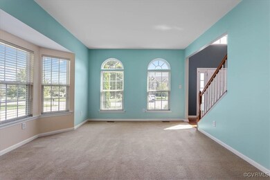Carpeted spare room with a wealth of natural light