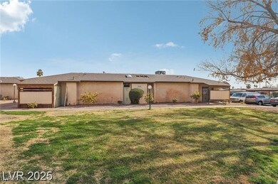 View of front of house featuring a front yard and stucco siding