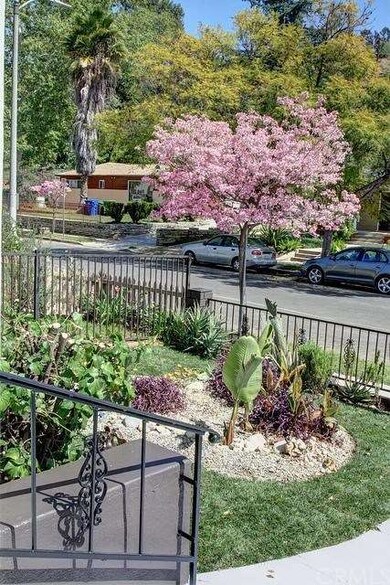 Beautifully landscaped front yard with new sod