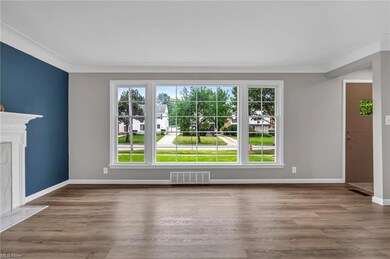 New living room picture window, LVT flooring, fire