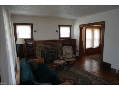 Living Room with gas log fireplace, built in book 