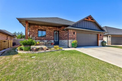 View of front of property with a garage and a fron