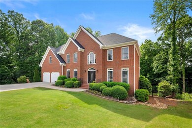 Grand front entry with impressive architectural details, and elegant symmetry.