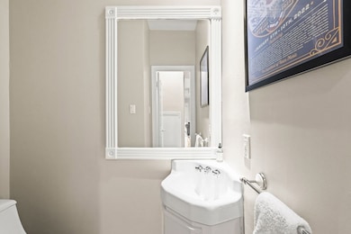 The half-bathroom sits next to the kitchen.