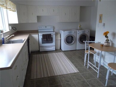 Kitchen w/ laundry area