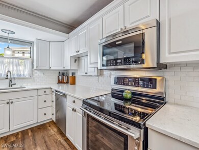 Kitchen with backsplash, stainless steel appliance