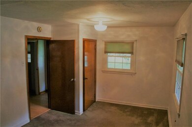 The first floor bedroom is spacious and has TWO cl
