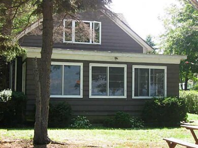 Exterior Front. View shows the converted porch win