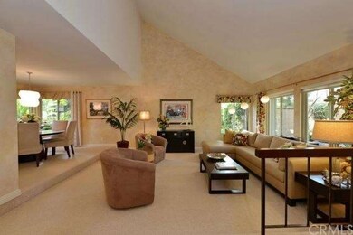 Sunken living room with cathedral ceiling