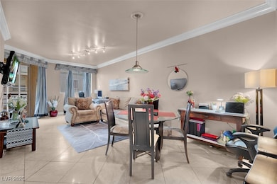 Dining room with light tile patterned floors and o