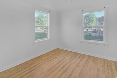Room with wood finished floors and baseboards