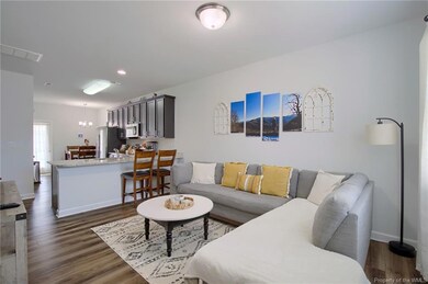 Living room offers a lot of natural lights and is open to the kitchen.
