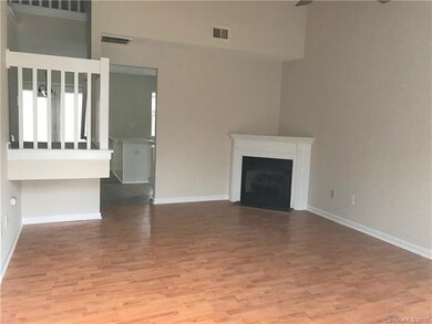 2 Story Living room with laminate wood floors and 