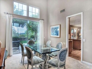 Formal dining room opens to the backyard and beyon