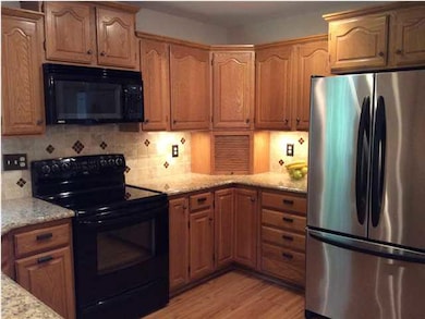 Pantry...pull out trash bin...wood laminate floori