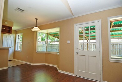 BREAKFAST ROOM WITH BAY WINDOW OVERLOOKING THE BAC