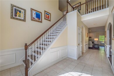 Stairs with a decorative wall, visible vents, a hi