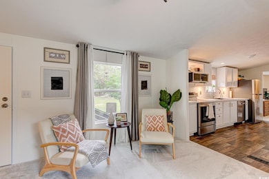 Living area with dark wood-type flooring