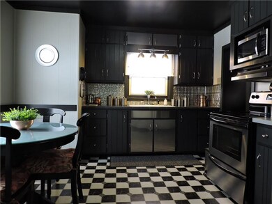 Inviting, contemporary eat-in kitchen with seasona