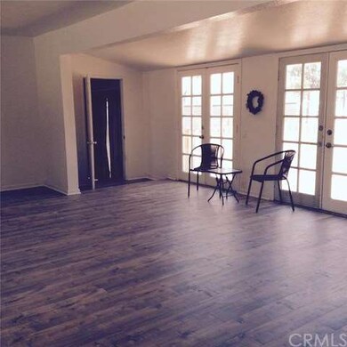 The French doors form the living room to the rear 