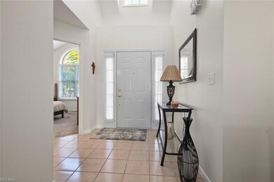 Foyer entrance featuring light tile flooring