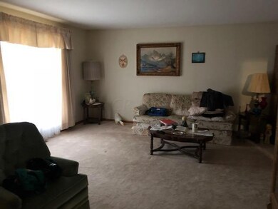 spacious living room with big window