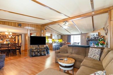 Living area with light wood-style flooring, wooden