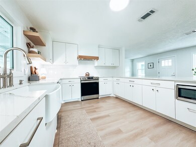Ample cabinetry and updated appliances, including a slide-in range, offer much to be desired in this elegant kitchen.