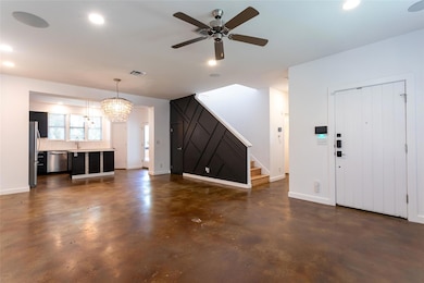 Unfurnished living room featuring finished concre