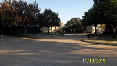 View of road featuring curbs and sidewalks