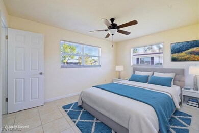 Bedroom featuring ceiling fan and light tile patte