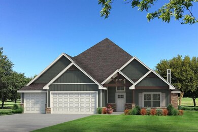 View of front facade with a garage and a front law