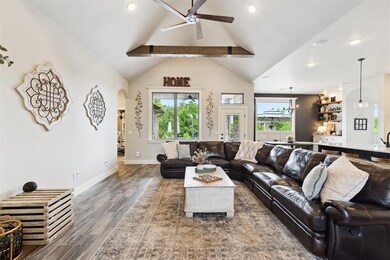 Living area featuring ceiling fan, healthy amount 