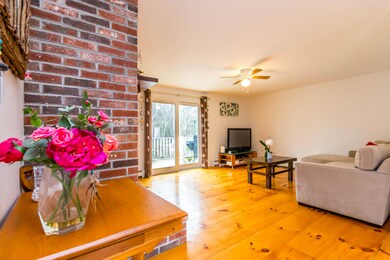 Spacious living room with wood floors